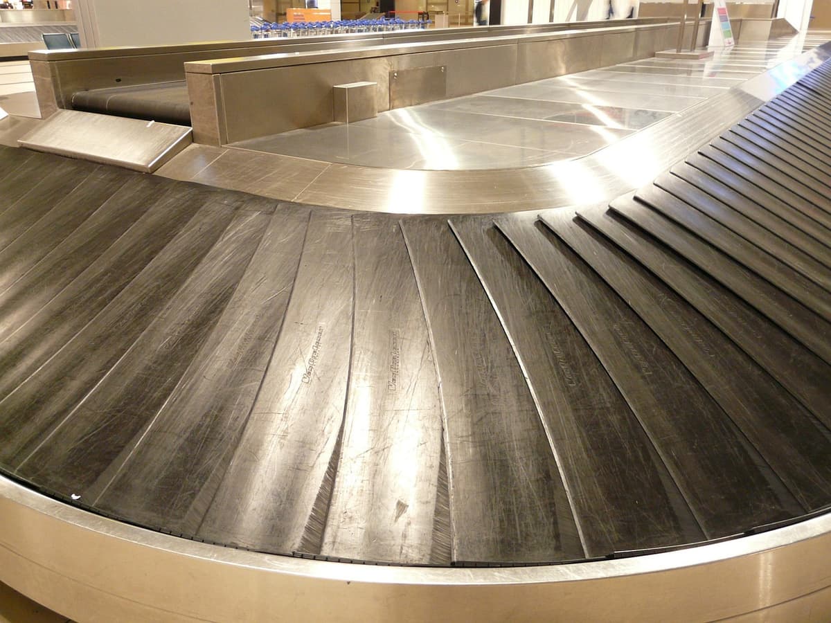 Luggage on an airport baggage claim conveyor belt